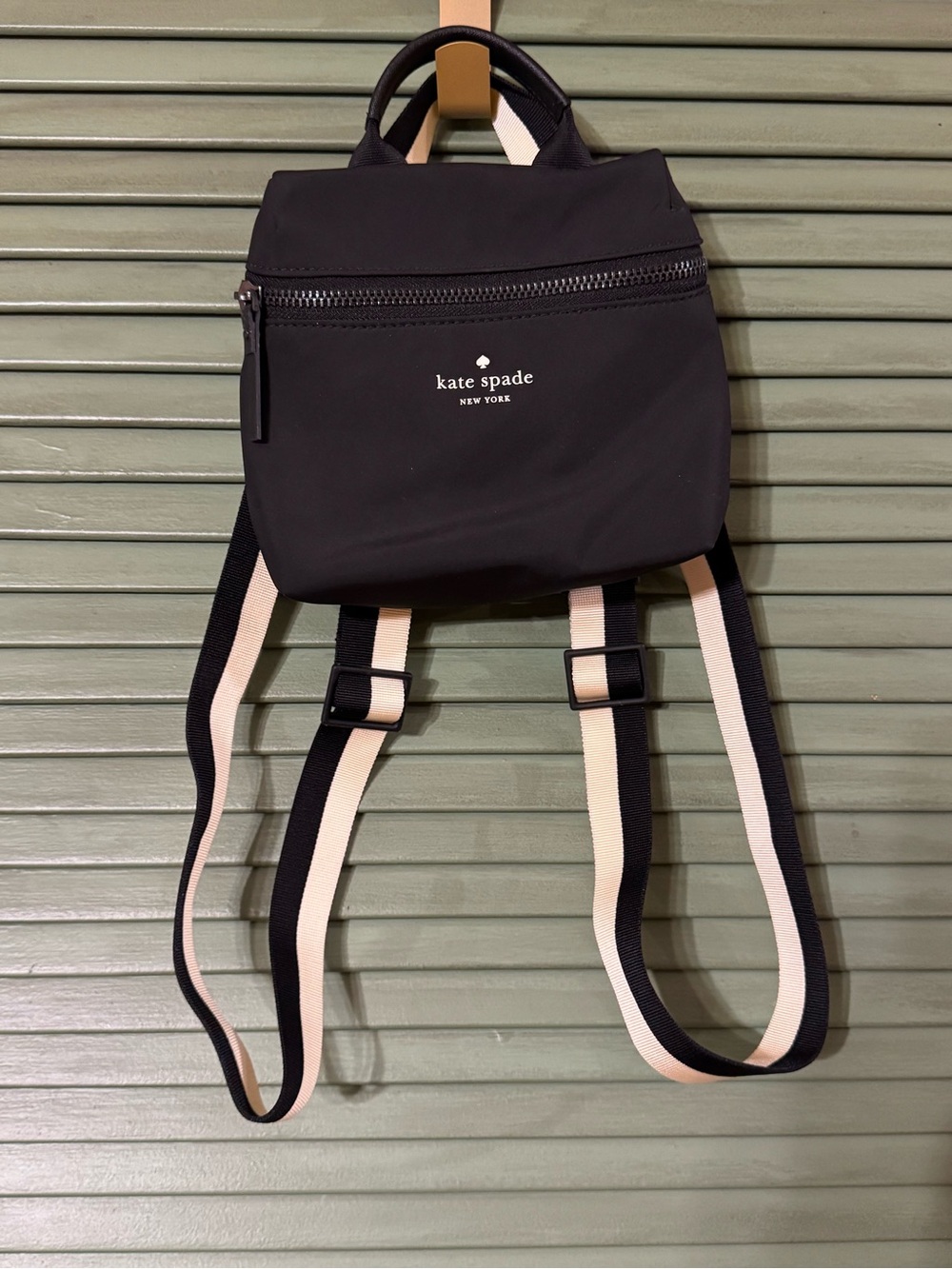 kate spade black mini backpack with cream-striped straps